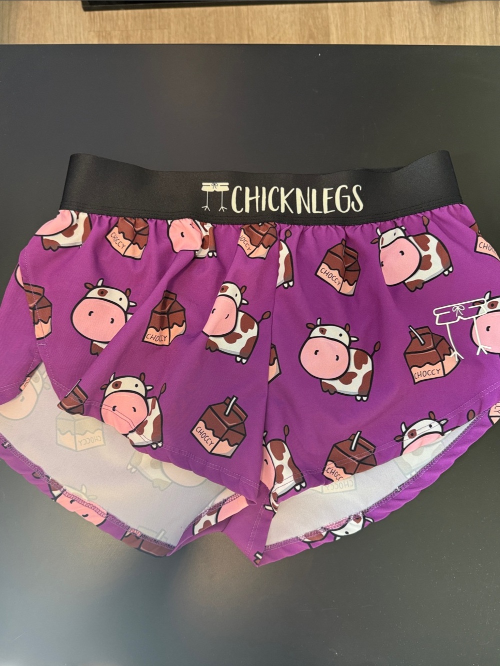 Chicknlegs Women's Purple Cow Print Athletic Shorts - Picture 1 of 9